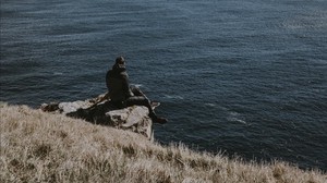 man, rocks, sea, grass, solitude, loneliness