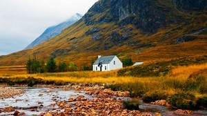 house, lake, stones, grass, mountains