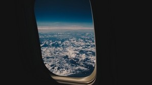porthole, plane, mountains