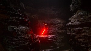 cave, man, laser sword, light - wallpapers, picture