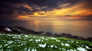 snow, grass, green, coast, sea, clouds, sky, orange, sunset, anomaly